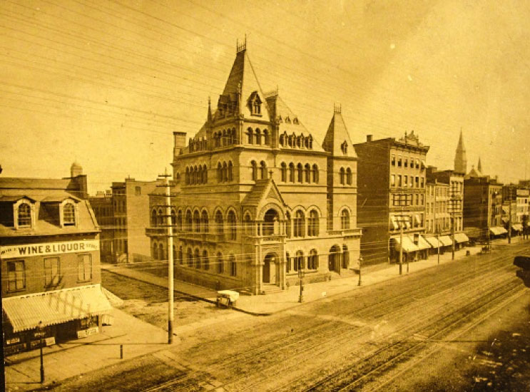 1876 photo of the Dry Dock Bank that once stood at 339-343 Bowery, at the corner of Bowery and 3rd Street. 